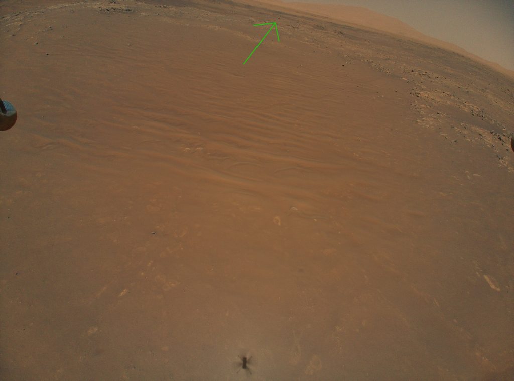 The image has a green arrow pointing to the persistent rover