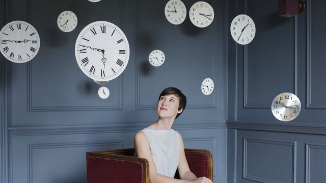 Woman looking at several hours