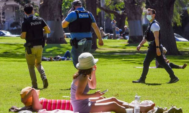 Police patrol the Carlton Gardens in Melbourne, Australia to prevent further demonstrations against Covid-19 rules Image: William West/AFP