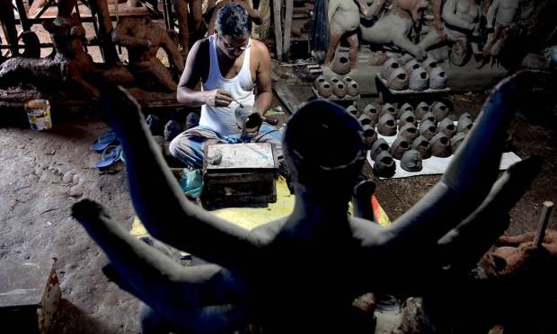A craftsman prepares a clay statue of Hindu goddess Durga before the Durga Puja festival in Vashi, Mumbai Image: INDRANIL MUKHERJEE / AFP