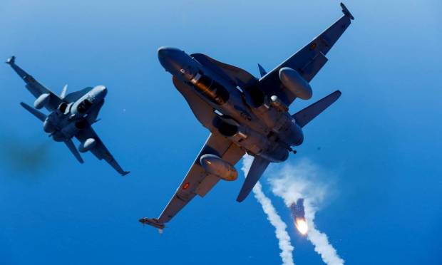 Two Spanish F-18 fighters fire missiles during the Ocean Sky 2021 military air advanced training exercise in the southern airspace of the Canary Islands, Spain, October 21, 2021. REUTERS/Borja Suarez TPX IMAGES OF THE DAY Photo: Borja Suarez/Reuters