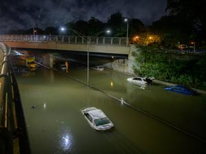 Sep 2, 2021 - Floods inundated vehicles after heavy rain on a highway in Brooklyn, New York, caused by Storm Ida - Ed Jones / AFP - Ed Jones / AFP