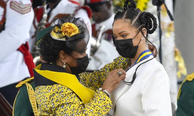 Rihanna, the 11th National Athlete of Barbados, was presented by President Dame Sandra Mason during the National Honors and Independence Day parade at Golden Square Freedom Park in Bridgetown, Barbados.  Photo: Randy Brooks / AFP