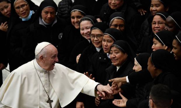 At the Vatican's Sala Paul VI, Pope Francis greets nuns at the end of his public visit Photo: FILIPPO MONTEFORTE / AFP