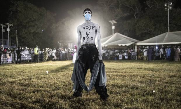 Man painted white in Banjul during the final campaign rally for the current president of the Gambia and his newly formed political party, the National People's Party Photo: John Wessels / AFP
