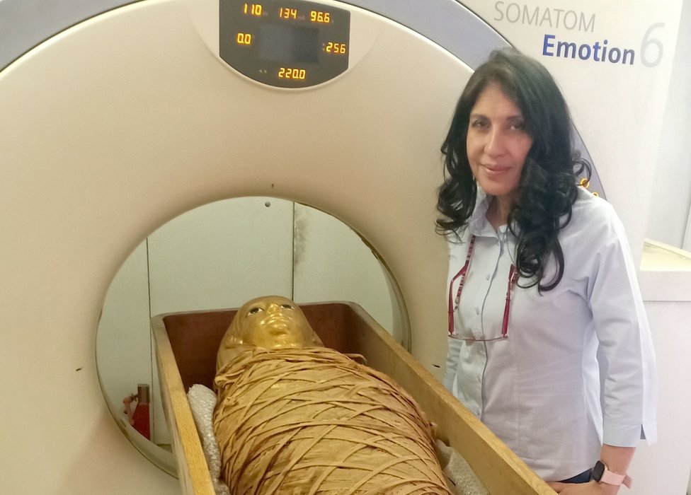 Sahar Selim, Professor of Radiology, Faculty of Medicine, Kasr Al-Ainy, Cairo University, next to the mummy of Amenhotep I and the CT scan machine.