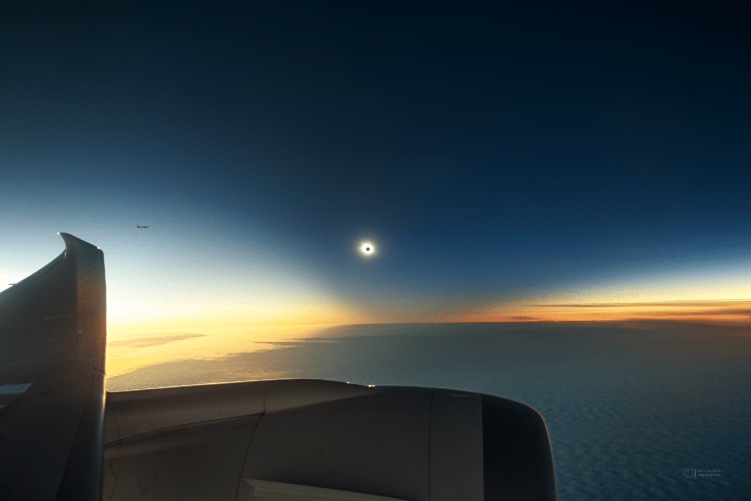 Eclipse from an airplane window over the Weddell Sea, part of the Antarctic Ocean - Peter Horak