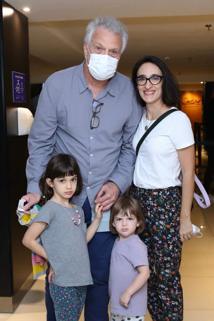Pedro Biel standing with his daughters and his wife at the cinema