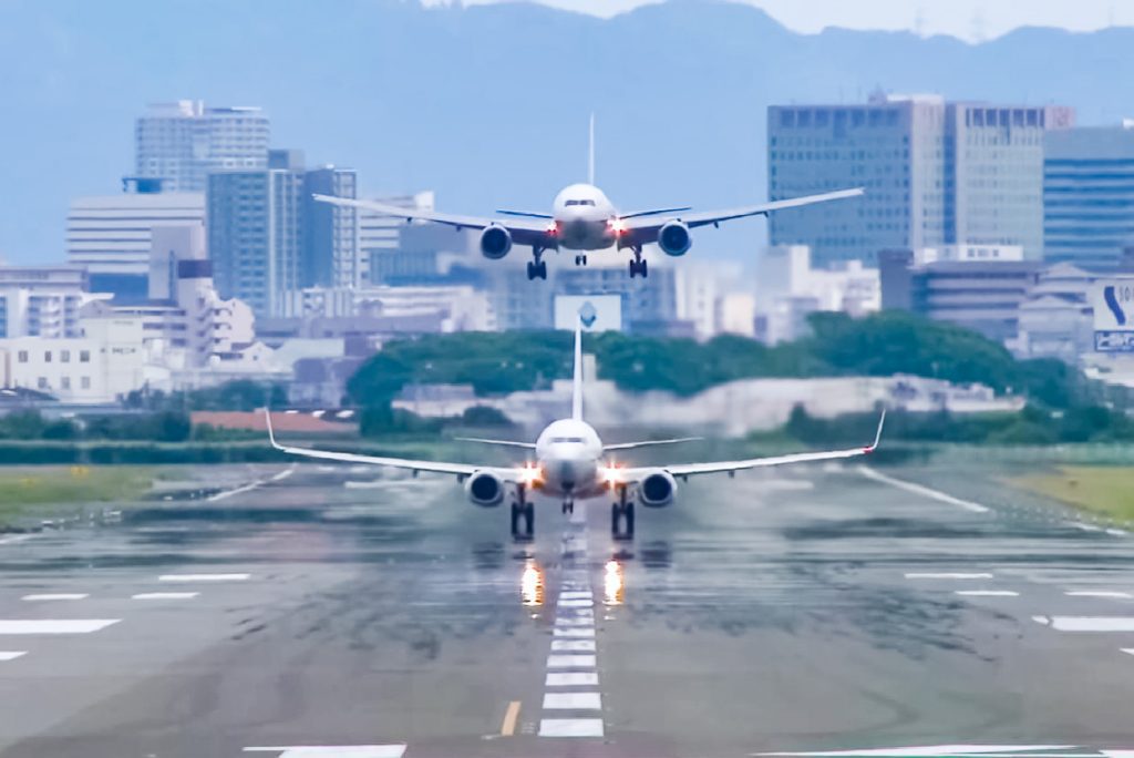 A plane takes off moments before another landing this weekend