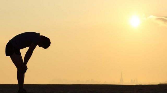 tired runner silhouette at dusk