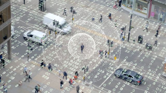 Color photography shows people on the street and programming numbers floating in the air